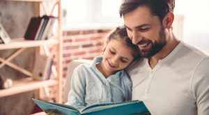 Cute,Little,Girl,And,Her,Handsome,Father,Are,Reading,A